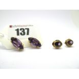 A Pair of Modern Single Stone Amethyst Earstuds, marquise four claw set, stamped "750"; together