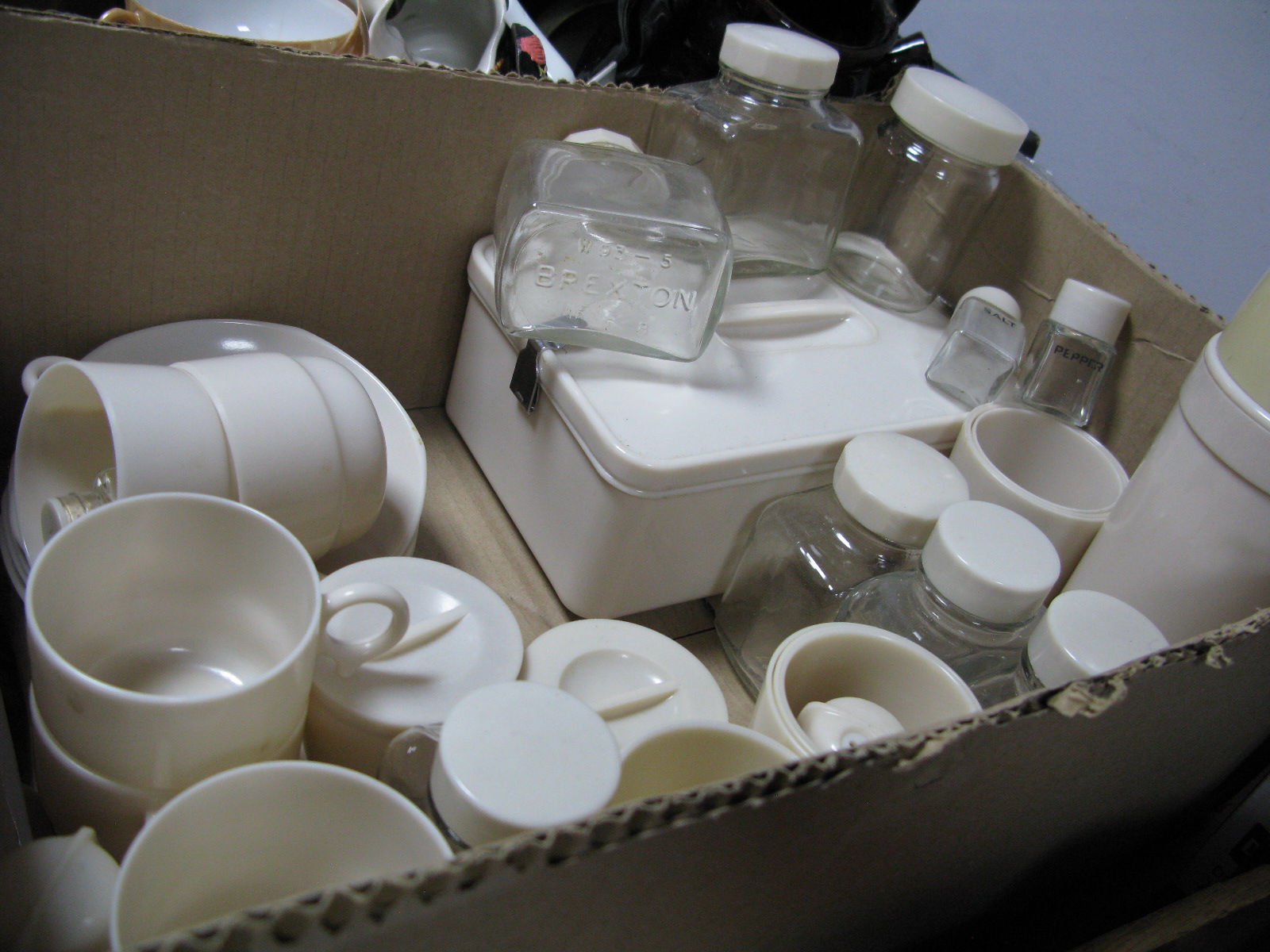 Cream Circa 1930's Picnic Ware, including Bandalasta picnic box, cup and saucers, condiment sets,