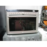 An LG Solardom 900W Microwave Oven.