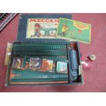 A 1930 Meccano Set No 3, red and green plus a clockwork motor, unchecked, playworn, includes four