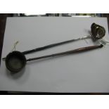 A Georgian Toddy Ladle, the bowl with side lip and inset coin to base (1762), twisted handle,