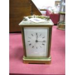 An Early XX Century French Carriage Clock, with enamel dial, Roman numerals.