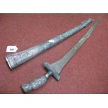 A XIX Century Malaya Kris with Ornate White Metal Grip and Sheath, overall length 65cm, signs of