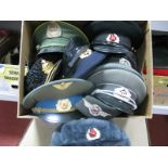 Nine Russian, Eastern European Military Peaked Caps and Hats, including Russian Navy Winter Hat.