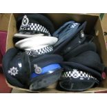 Nine Predominantly Second Half XX Century British Police Peaked Caps and Hats, many with badges