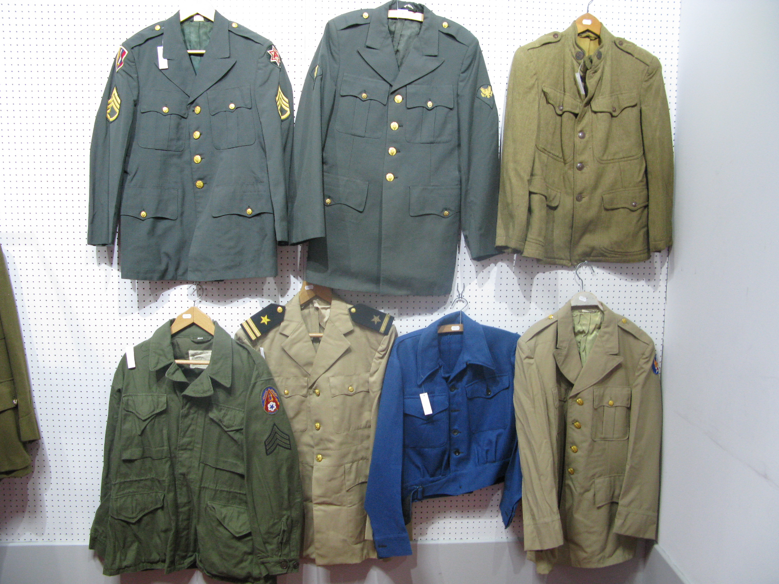 Seven Assorted Post War United States of America Army Tunics and Blouses.