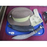 A WWII Period Military Canvas Pistol Holder, dated 1942, a post war slouch hat, a Kukri knife.