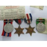 A Set of Four WWII Medals, War Medal, Defense Medal, France Germany Star, 1939-45 Star.