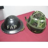 A WWII Era Tommy Helmet, marked 'FAP', plus a 2nd half XX Century British helmet.