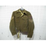 A British WWII Battle Dress Blouse to R.E.M.E. Dated 1943.