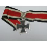 A Reproduction German 3rd Reich Iron Cross with Swords and Glass Diamonds.