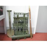 Four Mid XX Century Military Items, including aluminium backpack, wooden brass tipped pacestick,