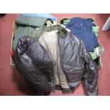 A Quantity of Predominately Modern Military Clothing, including jackets, shirts, jumpers,