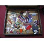 A Quantity of Modern Military Reproduction Medals, both British and World, presented in a wooden