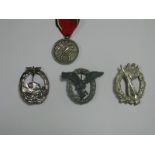 Four Reproduction German 3rd Reich Campaign Badges/Medals, including silver infantry assault.