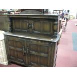 Ercol Buffet Sideboard, with cup and cover supports and panelled doors. 118cm wide, labelled.