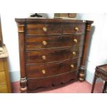 A XIX Century Mahogany Bow Front Chest, of two short and three long drawers, turned handles having