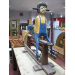 Beatles Interest: A carved wooden rocking horse, modelled with the head of Sgt Pepper era, John