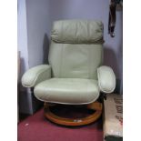 A Pale Green Leather Adjustable Easy Chair, on circular bentwood base.