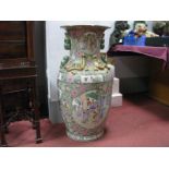 A Large Satsuma Style Oriental Pottery Floor Vase, featuring many figures in garden scenes, gilt