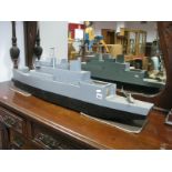 A Scratch Built Wooden Naval Ship, painted in battleship grey, fixed with model helicopter.