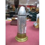 Trench Art Money Box in the form of a bullet with 1914, 1918 and red cross to body. 16.5cm high.