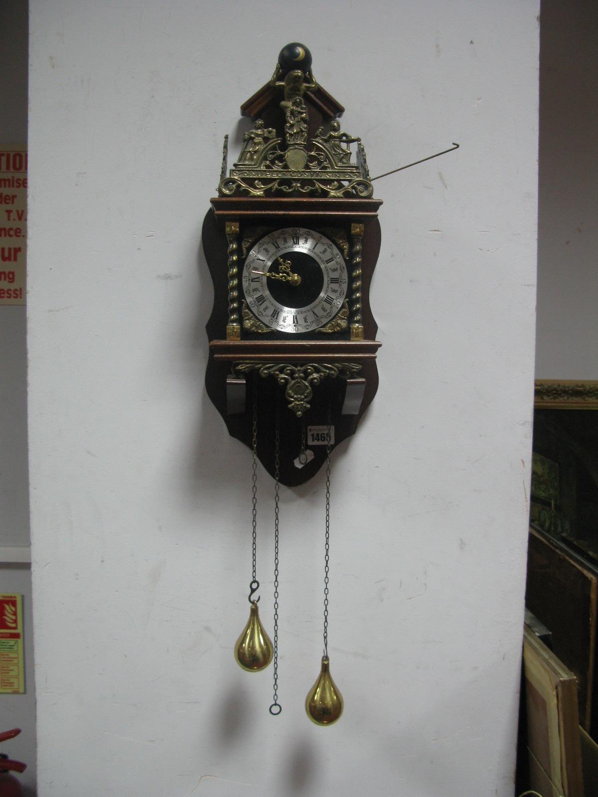 A Dutch Wall Clock, with German movement and brass pear drop weights.