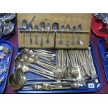 Assorted Brass Cutlery, Butlers retro wooden handle cutlery, souvenir and other spoons on a wooden
