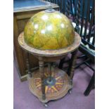 Drinks Globe, with a hinged top, on turned supports with under shelf.