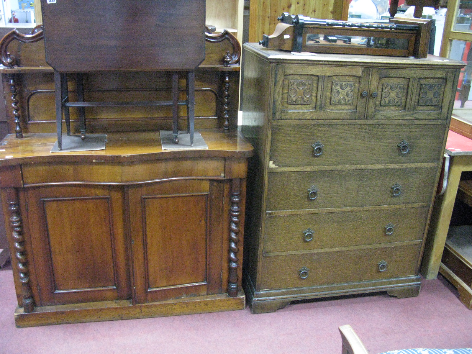 XIX Century Chiffonier, with serpentine shelf and central drawer, over two cupboard doors with