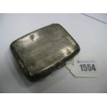 A Hallmarked Silver Cigarette Case, J.G. Ltd, Birmingham 1927, allover engine turned, initialled.