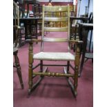 Beech Ladder Back Rocking Chair, with raffia seat, on turned and block supports united by turned
