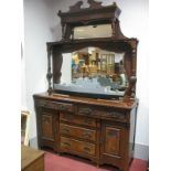 A Late XIX Century Walnut Mirror Back Sideboard, with Art Nouveau poker work carving to swan neck