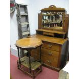 An Early 1900's Arts and Crafts Golden Oak Dressing Table, the swivel mirror supported on a frame