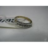 A Modern 9ct Gold Diamond Set Half Eternity Band, rubover set throughout, stamped ".25".