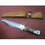 A Bowie Knife by J. Nowill & Sons, in leather sheath, 16" overall length.