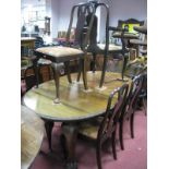 XX Century Mahogany Oval Shaped Dining Table, on cabriole legs, claw and ball feet (with an extra