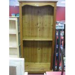 A Pine Bookcase, with stepped pediment, reeded sides and adjustable shelves, 86.5cm wide.