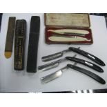 A Pair of XIX Century Cut Throat Razors, with ivory scales in a leather box, stamped Joseph