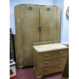 A 1930's Limed Oak Double Wardrobe, with gilt scroll period applied panels, matching chest of