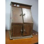 An Edwardian Mahogany Table Top Stationary Cabinet, with slope front doors over similar drawers,