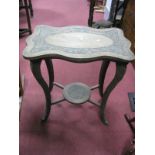 An Oak Occasional Table, shaped rectangular top with foliate relief carved inset border, with