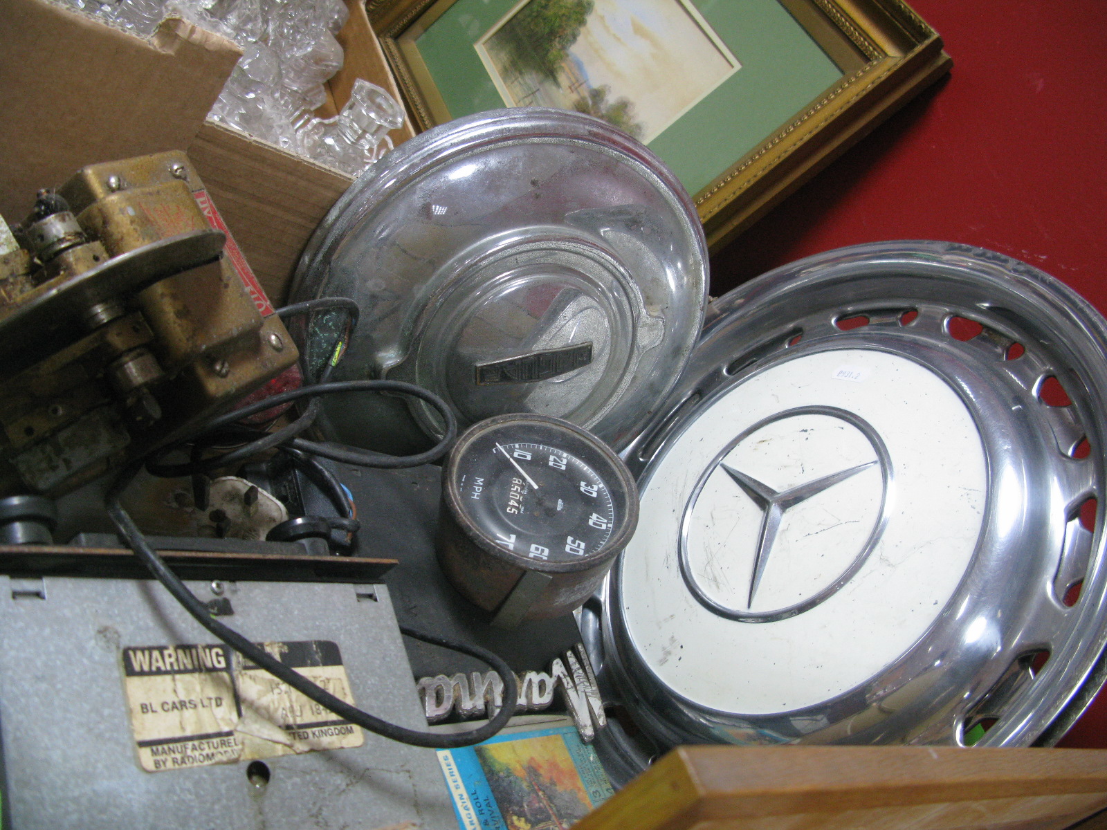A Pair of Mercedes Hub Caps, Jaguar hub cab, tape and eight track players, Milometer, etc:- One Box