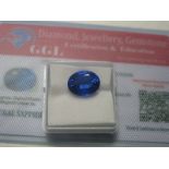 An Oval Cut Sapphire, unmounted; together with a Global Gems Lab Certificate card stating carat