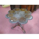 An XVIII Century Style Mahogany Supper Table, the top of eight circular discs with carved borders an