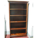 Mahogany Freestanding Bookcase, having dentil cornice, Corinthian column supports, four adjustable