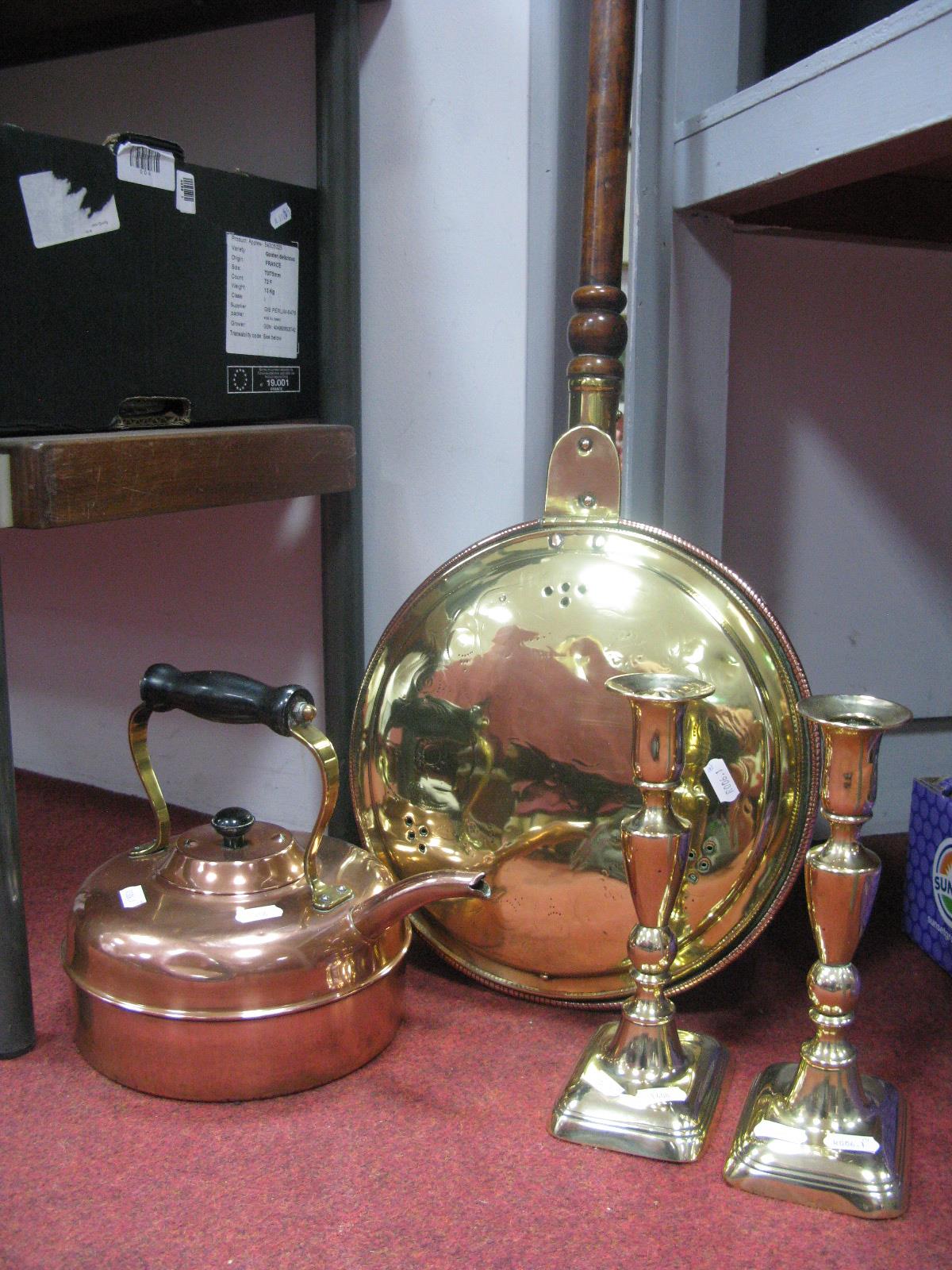 A XIX Century Copper Warming Pan, pair of XIX Century brass candlestick, copper kettle. (4)