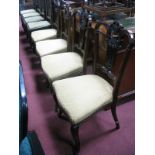 A Set of Four Late XIX Century Mahogany Salon Chairs, with a pierced and shaped top rail,