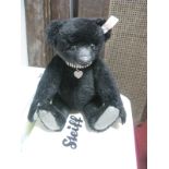 A Modern "Steiff" Growler Jointed Bear, 663741, in ornate collar suspending heart pendant, 30cm