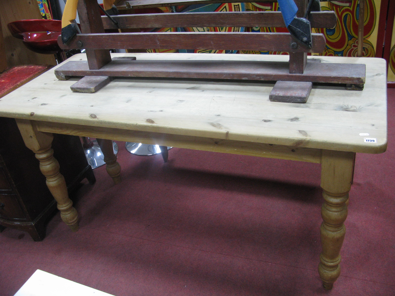 A Rectangular Shaped Pine Kitchen Table, on turned and block supports.